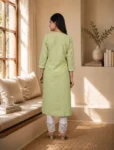 bhavini-pastel-green-white-embroidered-kurta-set-front-walking-view-sunlit-lounge-casual-ethnic-wear