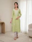 bhavini-pastel-green-white-embroidered-kurta-set-front-walking-view-sunlit-lounge-casual-ethnic-wear