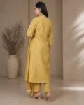 bhavini-mustard-yellow-white-embroidered-kurta-set-front-view-heritage-arch-location-festive-wear