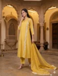 bhavini-mustard-yellow-white-embroidered-kurta-set-dotted-dupatta-elegant-pose-heritage-courtyard-festive-wear