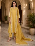 bhavini-mustard-yellow-white-embroidered-kurta-set-dotted-dupatta-elegant-pose-heritage-courtyard-festive-wear