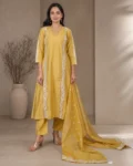 bhavini-mustard-yellow-white-embroidered-kurta-set-front-view-heritage-arch-location-festive-wear