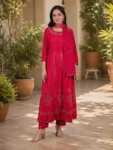 bhavini-red-gold-embroidered-anarkali-suit-standingpose-courtyard-occasionwear