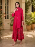 bhavini-red-gold-embroidered-anarkali-suit-standingpose-courtyard-occasionwear
