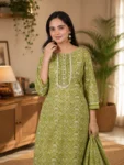bhavini-olive-green-floral-print-suit-standingpose-livingroom-casualwear