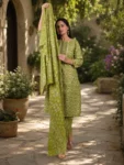 bhavini-olive-green-floral-print-suit-standingpose-livingroom-casualwear