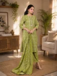bhavini-olive-green-floral-print-suit-standingpose-livingroom-casualwear