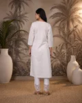 bhavini-white-pink-floral-kurta-walking-pose-terrace-garden-daywear