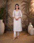 bhavini-white-pink-floral-kurta-walking-pose-terrace-garden-daywear