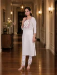 bhavini-white-pink-floral-kurta-walking-pose-terrace-garden-daywear