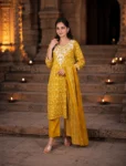 bhavini-mustard-yellow-floral-print-kurta-set-embroidered-yoke-front-view-indoor-festive-elegance